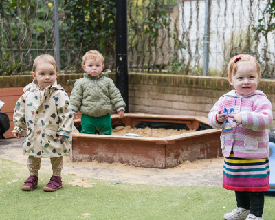 playing-in-sandpit-outside