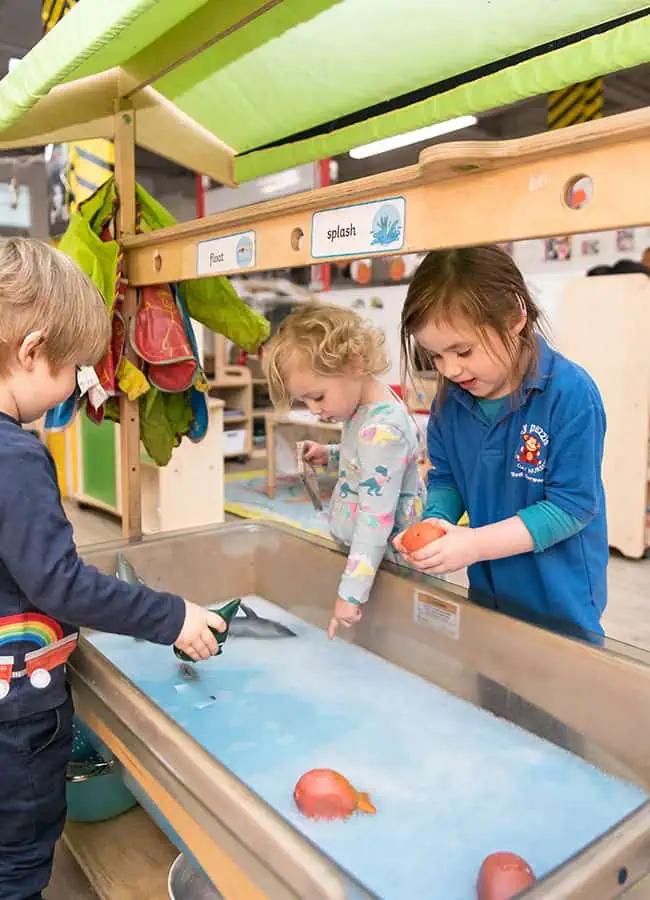 enjoying our water tray in preschool
