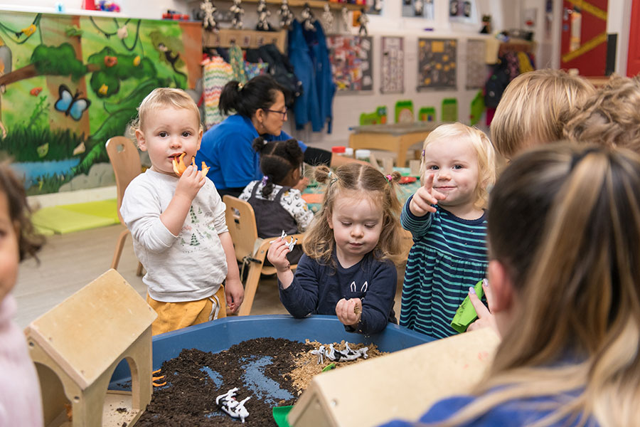 toddlers exploring activities at nursery